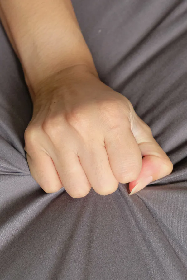 Female-Sexual-Dysfunction-Treatment Close-up of a woman's hand grabbing a sheet, indicating sexual pleasure. Get female sexual dysfunction treatment from Sandra McDonald, NP in Southwestern Ontario.