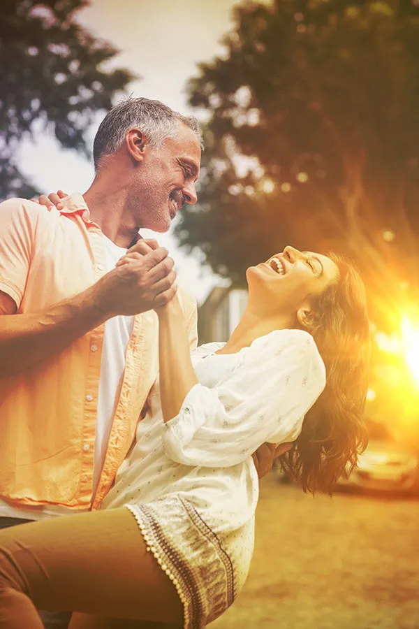 Wellness-Optimization-Plan-Treatment A happy couple dance outside at sunset. Get treatment with the Wellness Optimization Plan from Sandra McDonald, NP in Southwestern Ontario